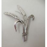An 18ct white gold brooch, fashioned as a bushel of wheat, set with diamonds