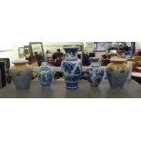 Decorative vases: to include a Dutch Delft example with cover, decorated with flora  16"h