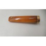 An Edwardian amber cheroot holder with a 15ct gold mount  cased