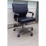 A modern black hide office chair, on a chromium finished swivel base