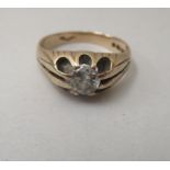 An 9ct gold Gypsy ring, set with a central diamond