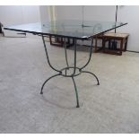 A modern terrace table, the glass top with rounded corners, upon a cast metal underframe  29"h  35"