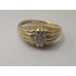 An 18ct gold Gypsy ring, set with a central diamond