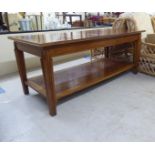 A modern hardwood reception office centre table, the top finished in a varying of exotic woods,