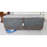 An early 20thC painted pine trunk with iron clasps  14"h  40"w  19"deep