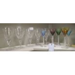 A set of six clear glass pedestal wines; and a set of five pedestal Martini glasses, each with