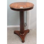 A mid 19thC satinwood pedestal table with a deep apron, raised on a tapered, octagonal column,