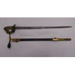 An early 20thC British naval officer's dress sword with a lion's head pommel and wire bound fishskin