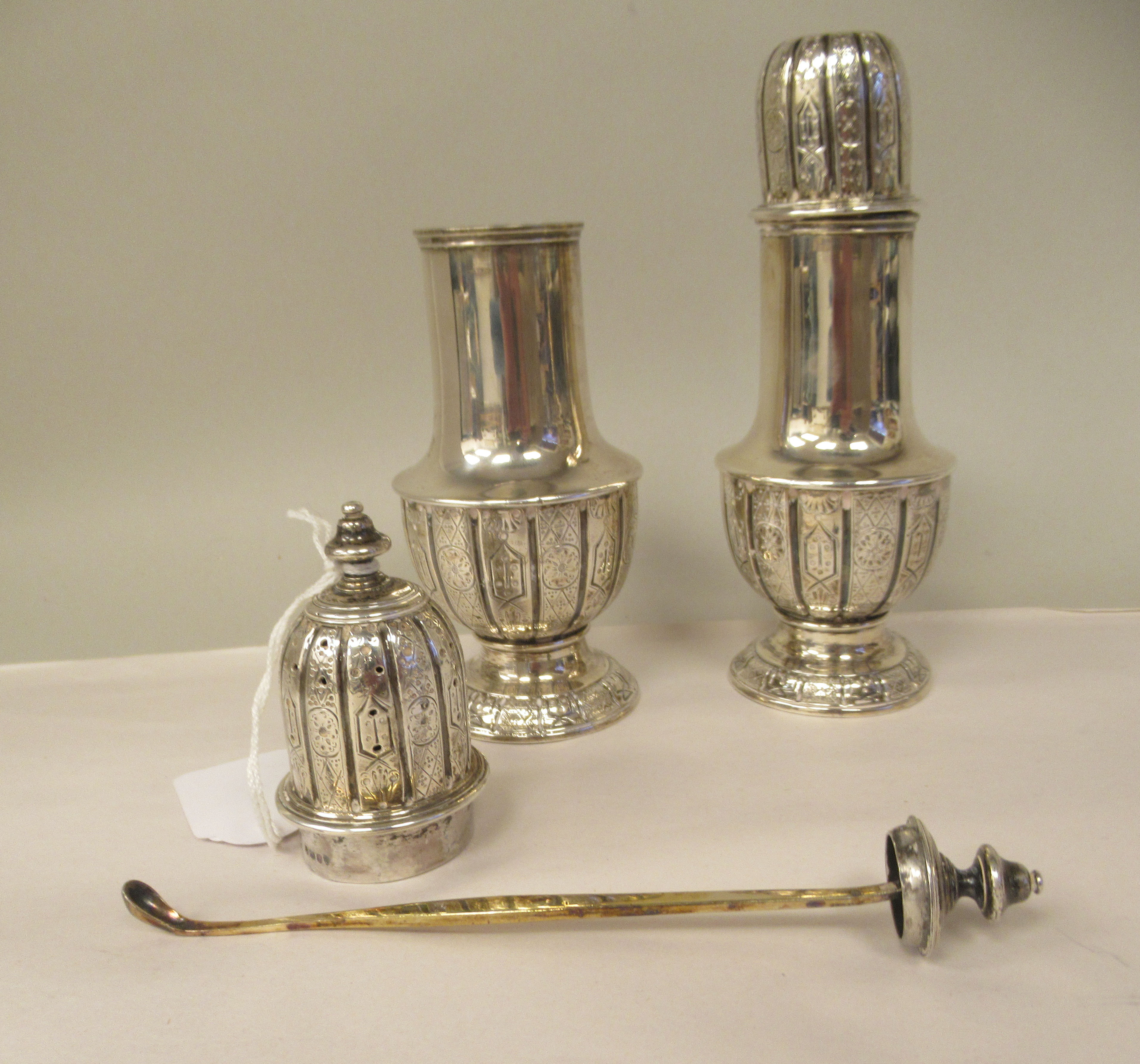 A pair of mid Victorian silver pedestal vase design condiments pots with uniformly engraved, - Image 3 of 4