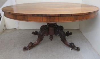 A mid Victorian rosewood breakfast table, the oval, figured veneered tip-top over a turned column