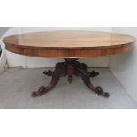 A mid Victorian rosewood breakfast table, the oval, figured veneered tip-top over a turned column