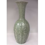 A 20thC Chinese celadon glazed and moulded porcelain, ovoid shape vase with a long, narrow neck