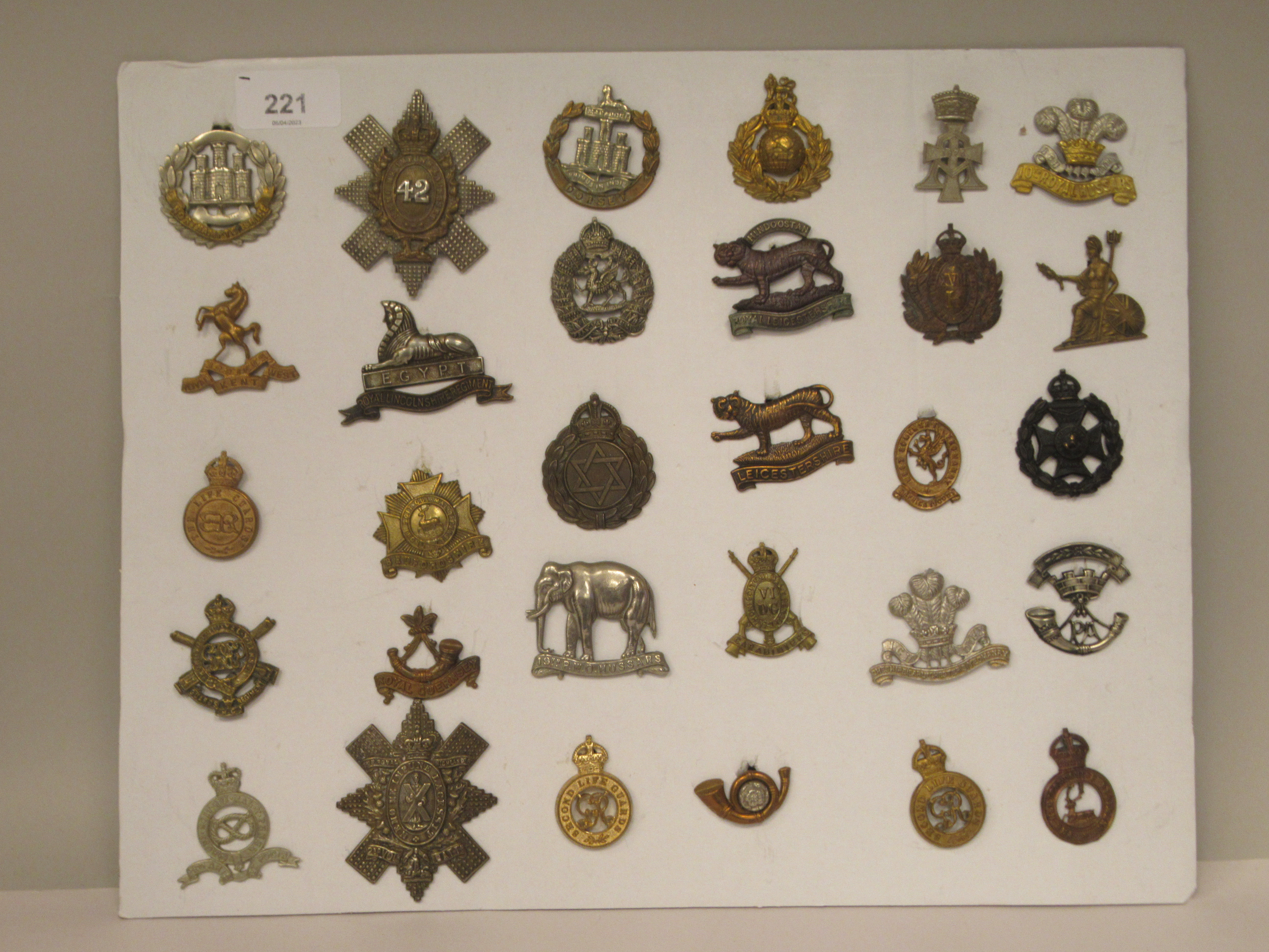 Thirty military cap badges and other insignia, some copies: to include The Life Guards, The Royal