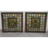 A pair of late 19thC stained and painted leaded glass window panels, each featuring a head and