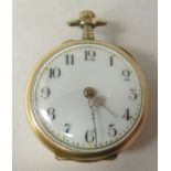 A lady's 14ct gold cased fob watch, the back set with three white stones (two test as diamonds)