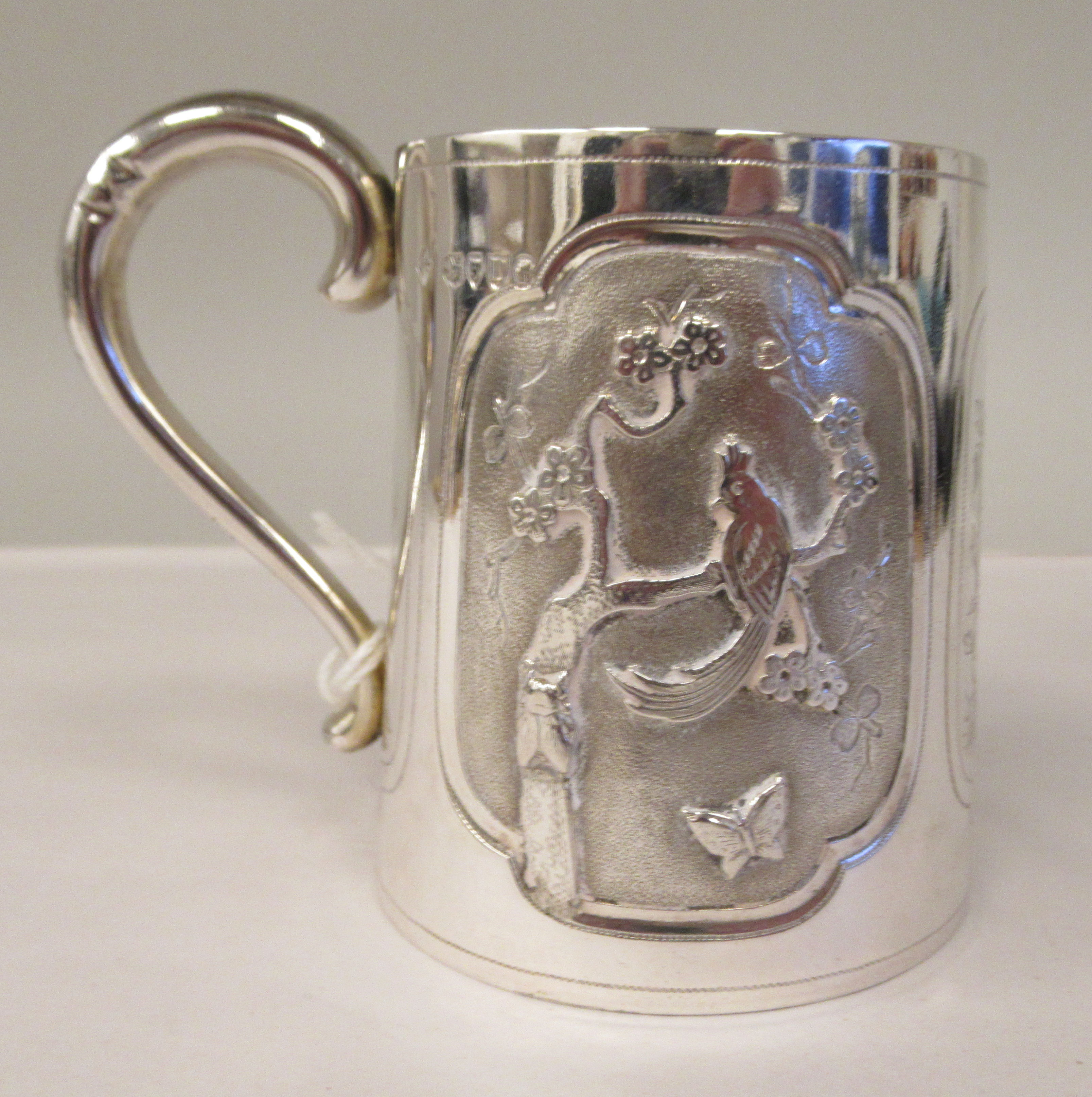 A late Victorian silver half pint Christening mug of tapered form, having a hollow loop handle, cast - Image 3 of 8