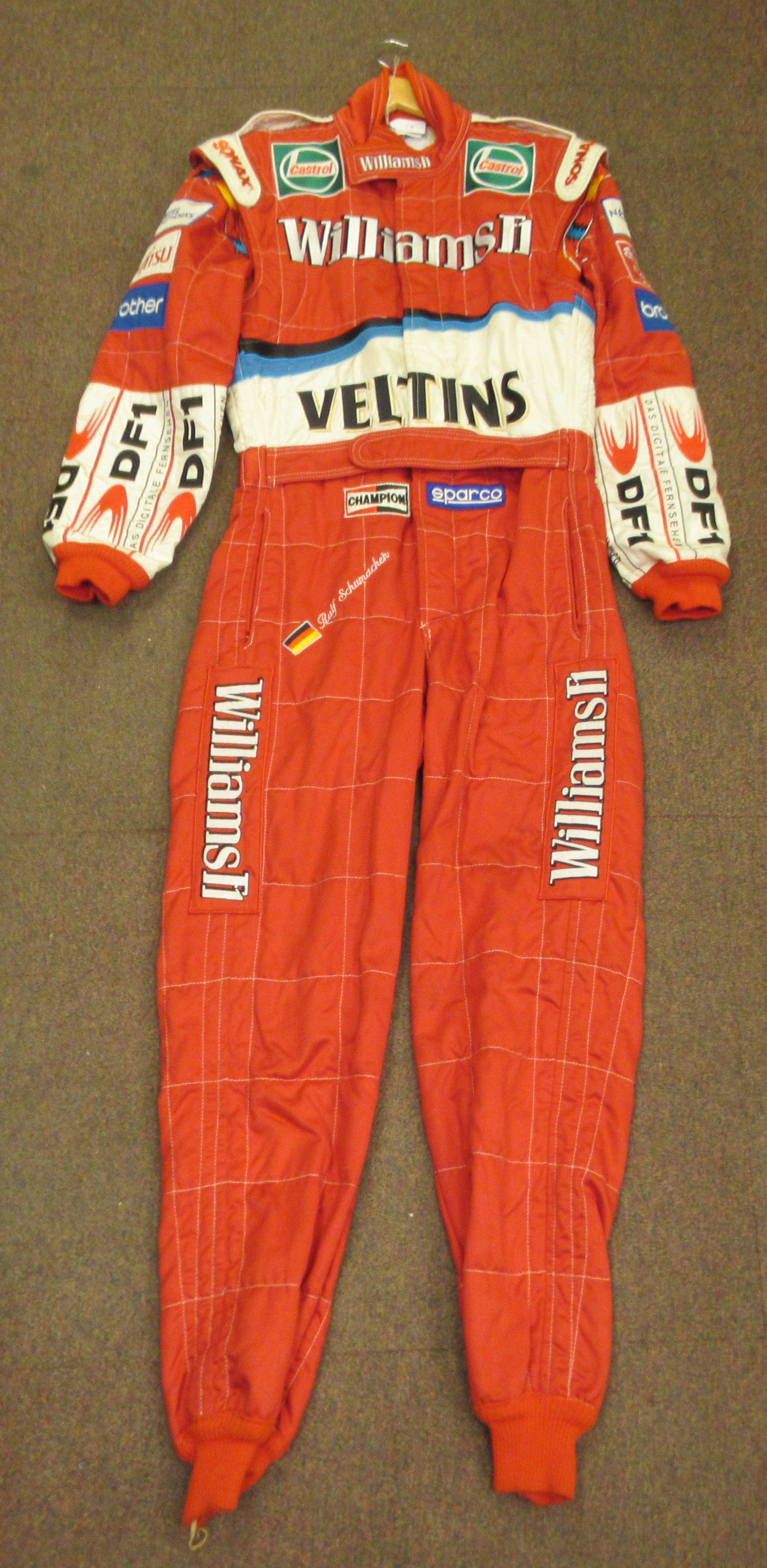 A Sparco Italian made red fabric racesuit, believed to have been owned by Ralf Schumacher, bearing