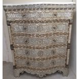 A 19thC style Continental serpentine front dressing chest, allover finished in engraved and carved
