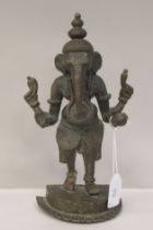 A late 19th/early 20thC bronze standing figure 'Ganesha' on a semi-circular plinth  10.5"h