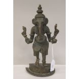 A late 19th/early 20thC bronze standing figure 'Ganesha' on a semi-circular plinth  10.5"h