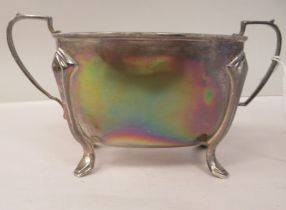 A silver sugar basin of tapered rectangular form with opposing loop handles on splayed, pad feet