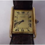 A Must de Cartier silver gilt, square cased wristwatch, the movement faced by a printed Roman