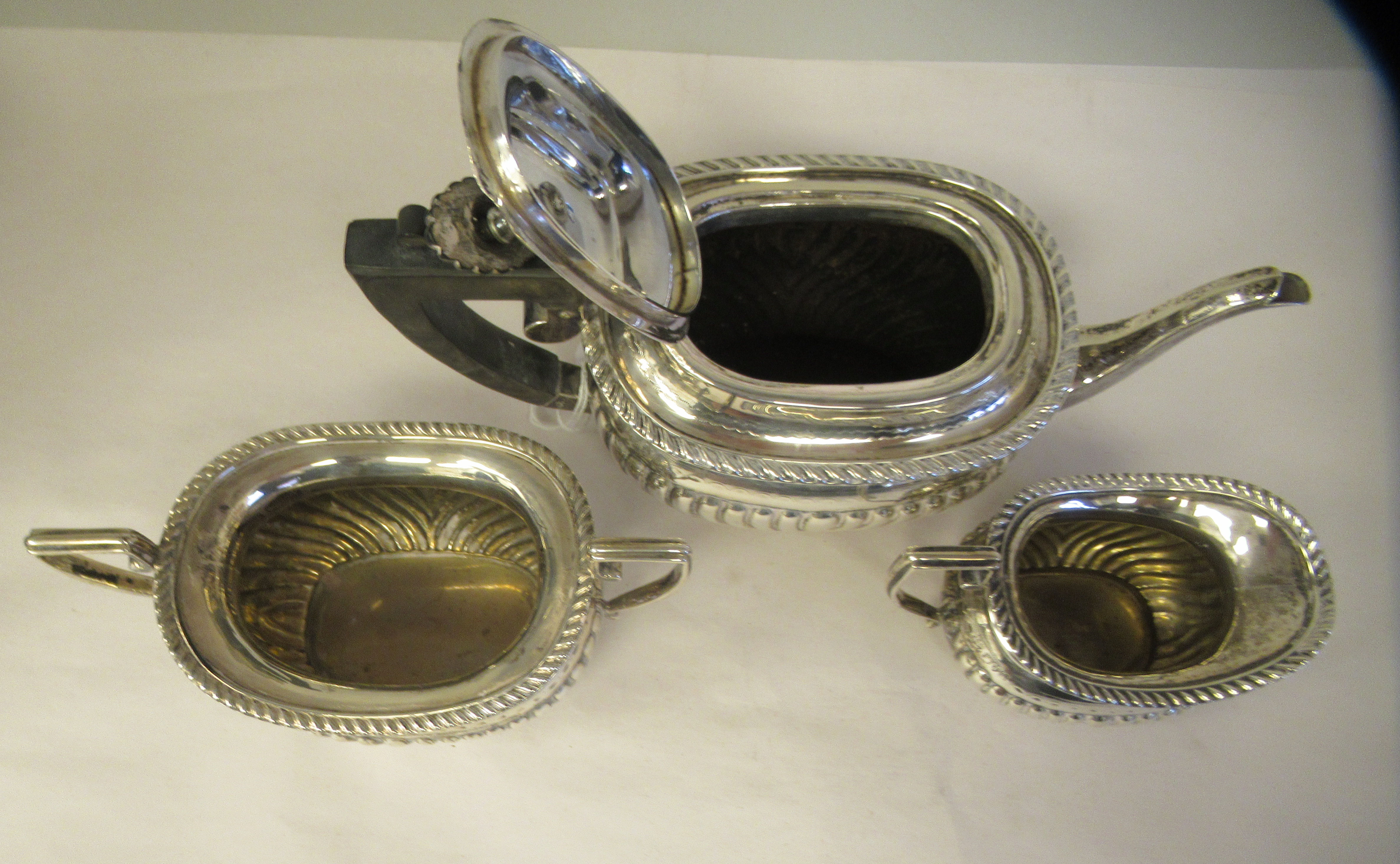 An Edwardian batchelor's three piece silver tea set of oval, ogee shape, demi-reeded form, - Image 7 of 9