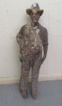A late 19th/early 20thC carved limewood papier mache mould, featuring a standing cowboy  39"h