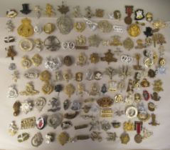 A miscellany of mainly British military and other cap badges and insignia, some copies: to include