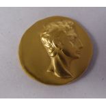 An Italian 22ct gold medallion, a replica of a coin featuring the profile portrait of Emperor