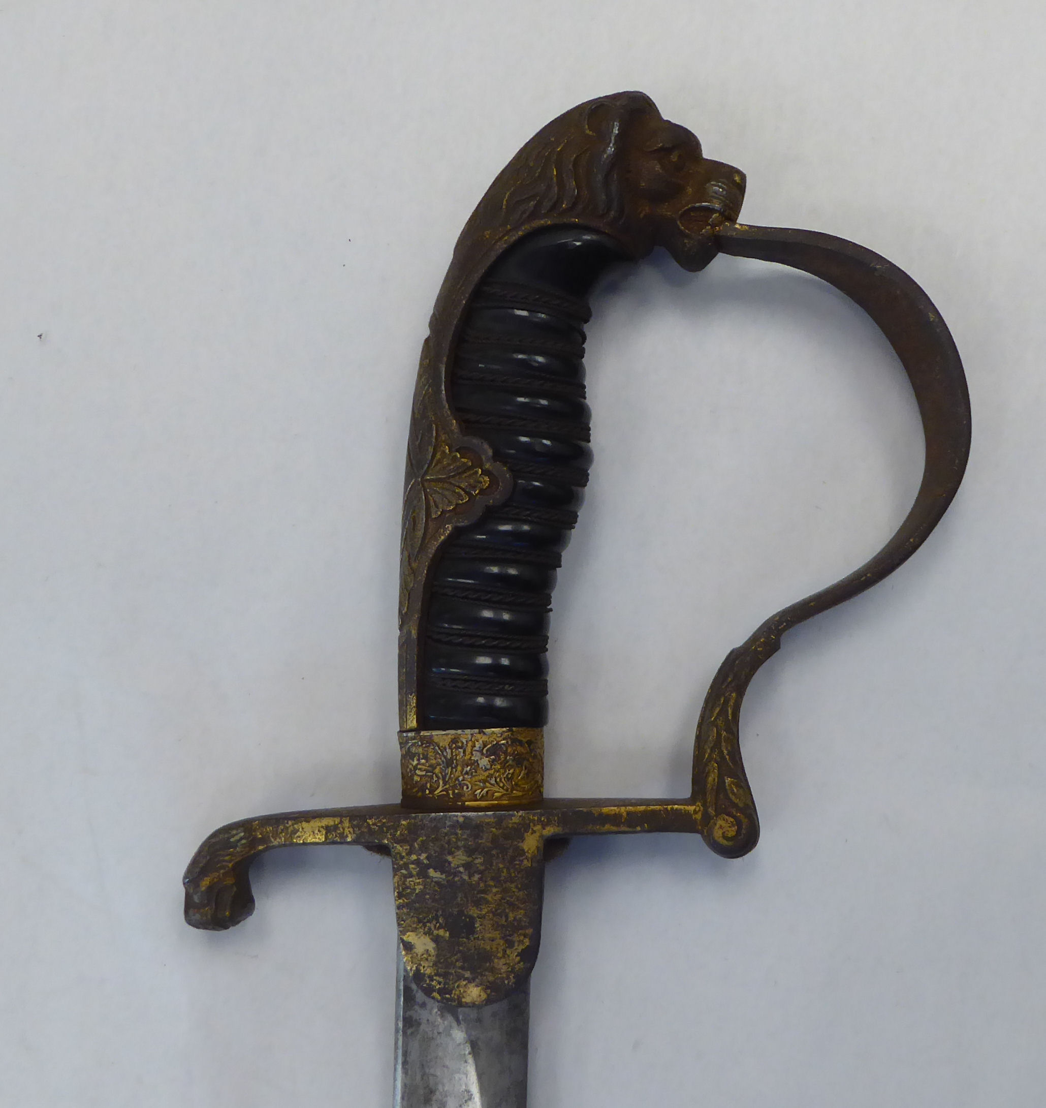 A German Weimar era cavalry dress sword with a gilded iron, lion's head pommel, guard, hilt and - Image 6 of 13