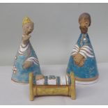 Two Margit Kovacs art pottery standing figures and a baby in a crib 7"h