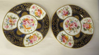 A pair of early 19thC Coalport china wavy edge plates, decorated in alternating panels with floral