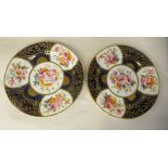 A pair of early 19thC Coalport china wavy edge plates, decorated in alternating panels with floral