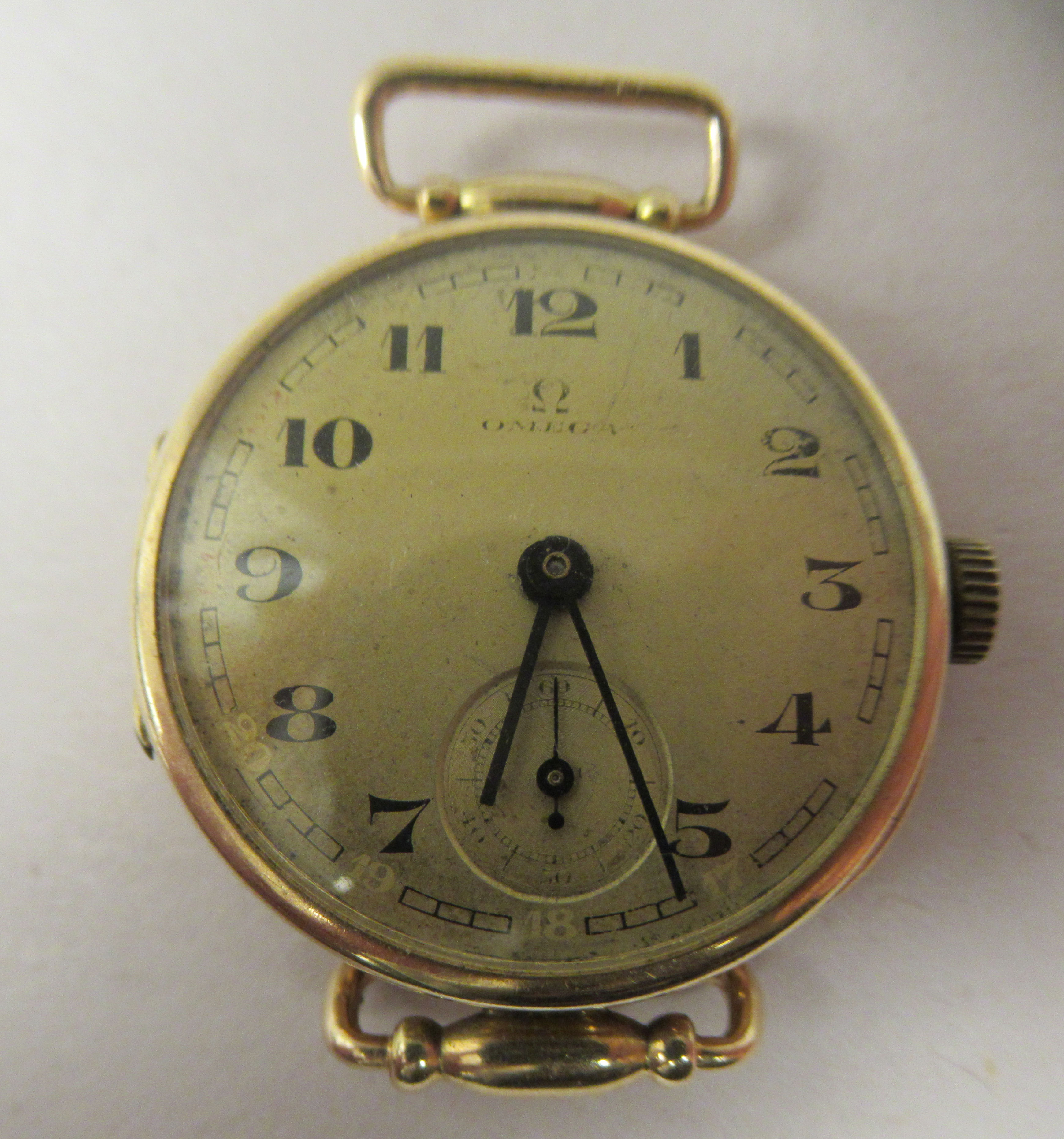 A lady's Omega 14ct gold round cased wristwatch, faced by an Arabic dial, incorporating subsidiary