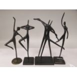 In the manner of Giacometti - four various bronze figures, ballet dancers  largest 13"h