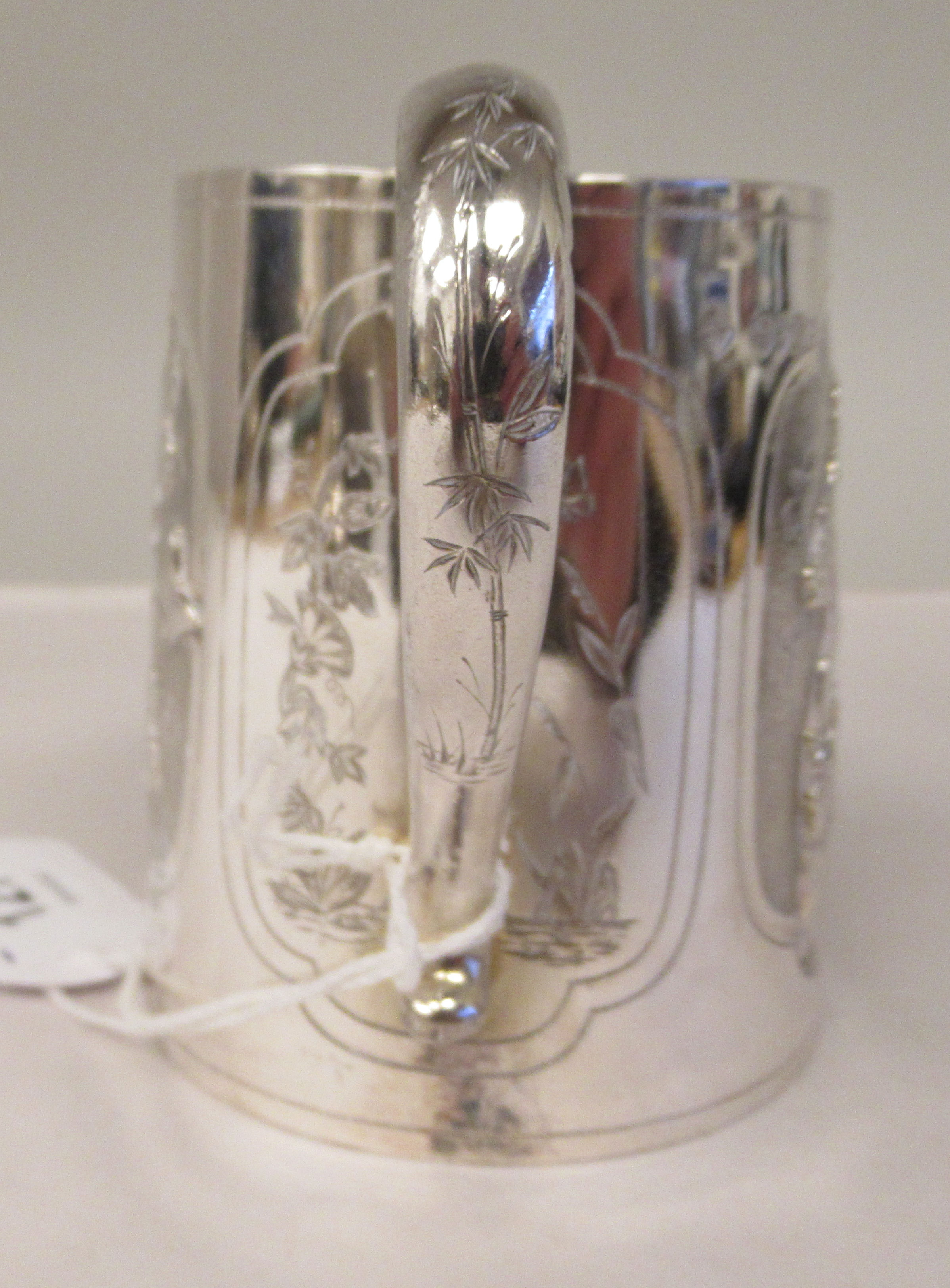 A late Victorian silver half pint Christening mug of tapered form, having a hollow loop handle, cast - Image 4 of 8