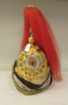 A British Cavalry officer's helmet with a chinstrap, red plume and adjustable liner (Please Note: