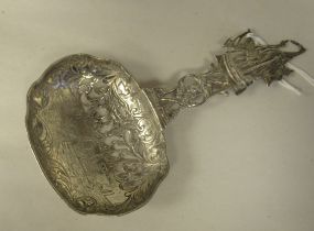 A Berthold Muller silver presentation spoon, the oval bowl with pierced and engraved pictorial and