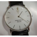 A Girard-Perregaux 18ct white gold cased quartz wristwatch, faced by a baton dial, on a dedicated