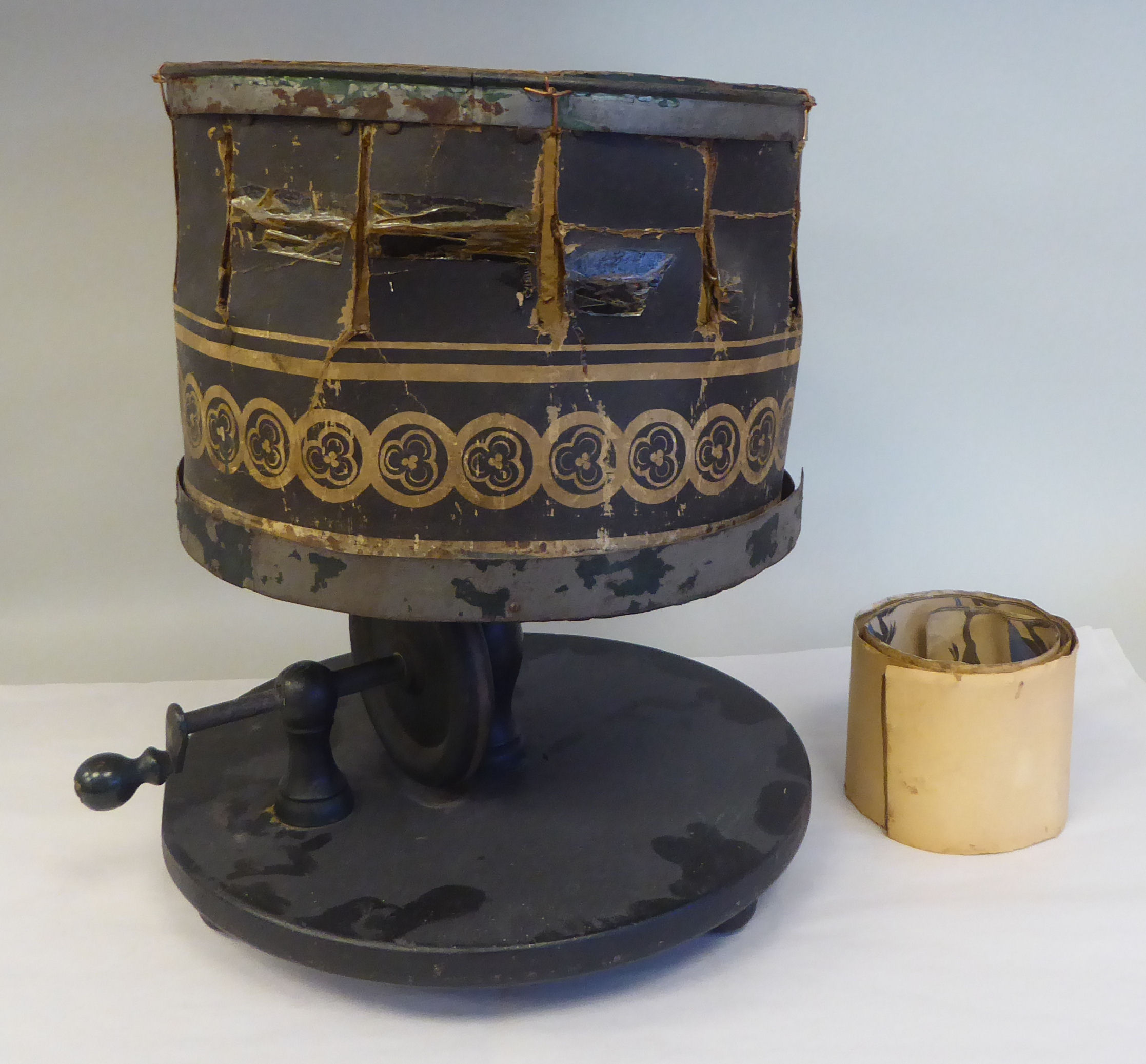 An early Victorian table top zoetrope, a pre-film, manually operated animation device, on a circular