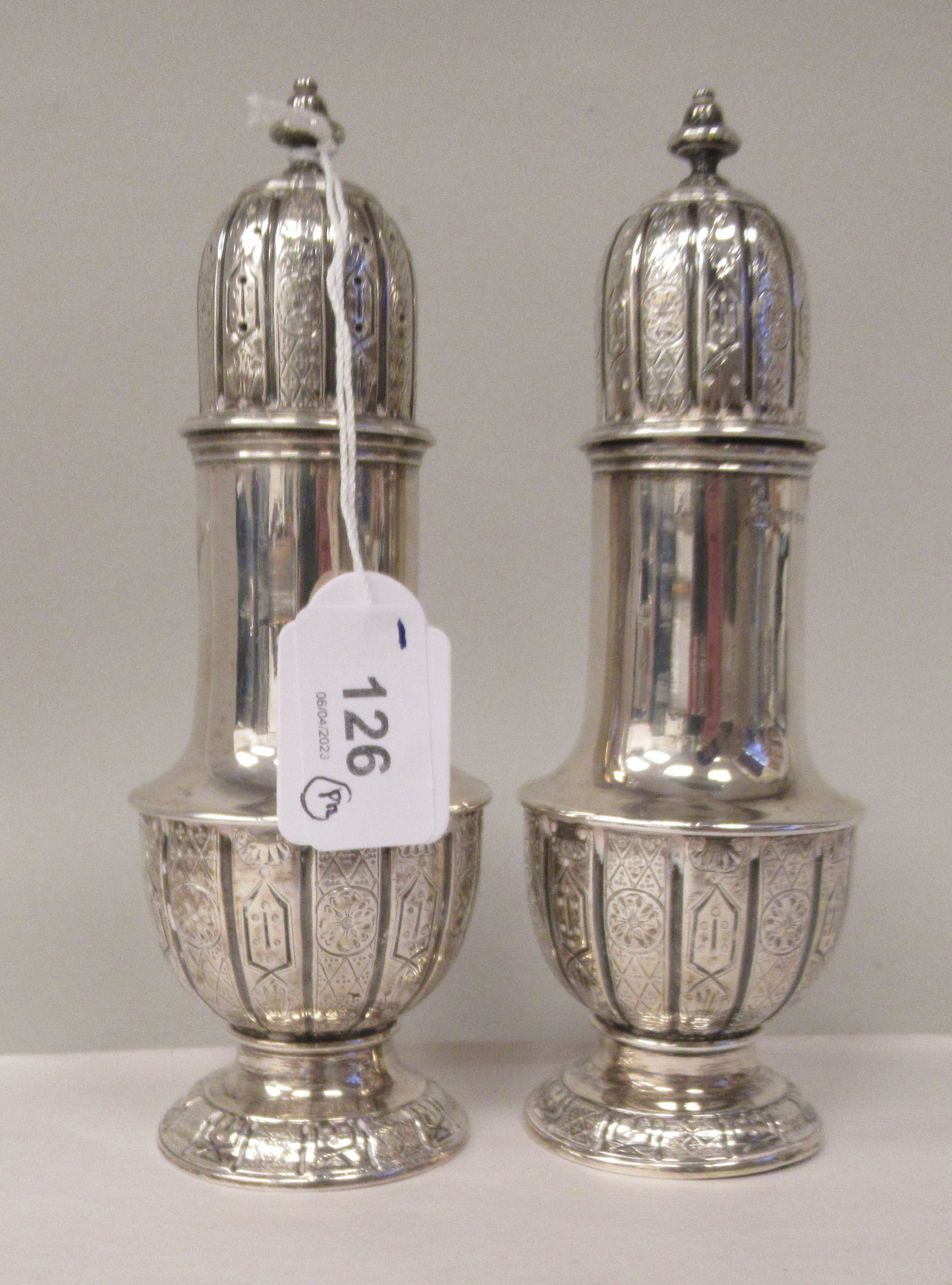 A pair of mid Victorian silver pedestal vase design condiments pots with uniformly engraved, - Image 2 of 4