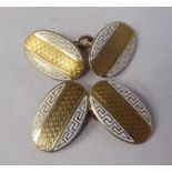 A pair of 9ct gold and white enamel oval tablet and chain cufflinks