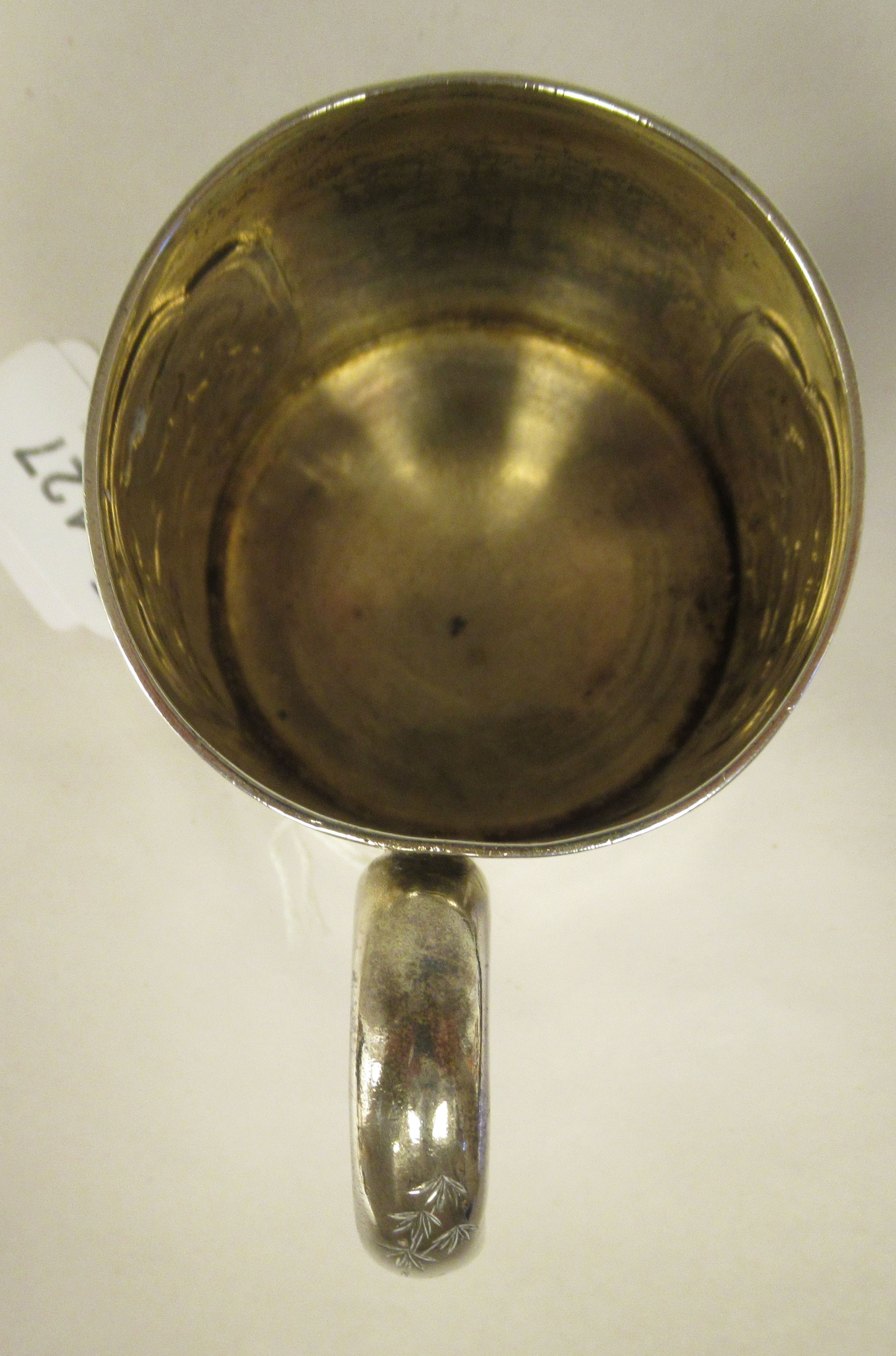 A late Victorian silver half pint Christening mug of tapered form, having a hollow loop handle, cast - Image 5 of 8