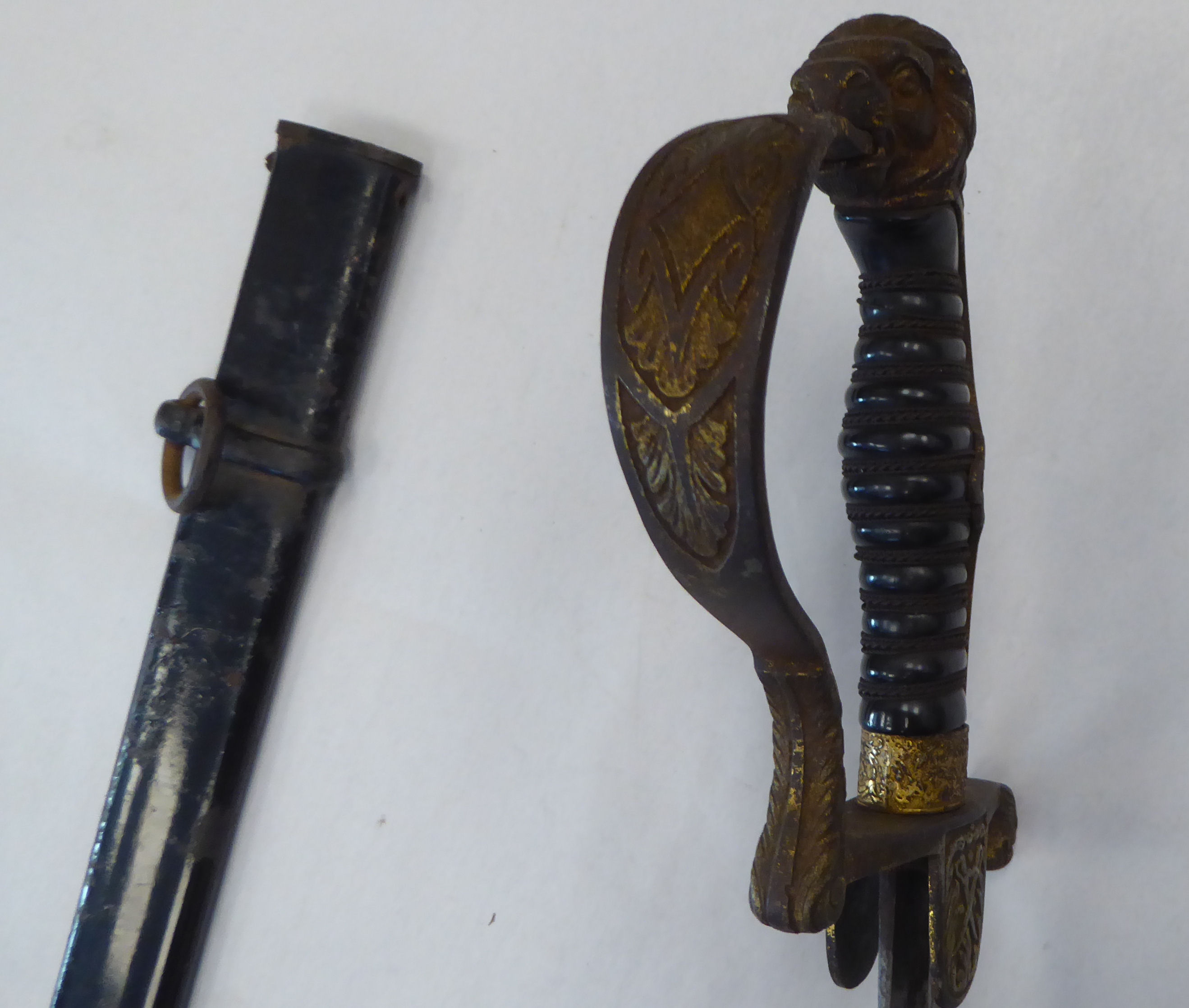 A German Weimar era cavalry dress sword with a gilded iron, lion's head pommel, guard, hilt and - Image 9 of 13