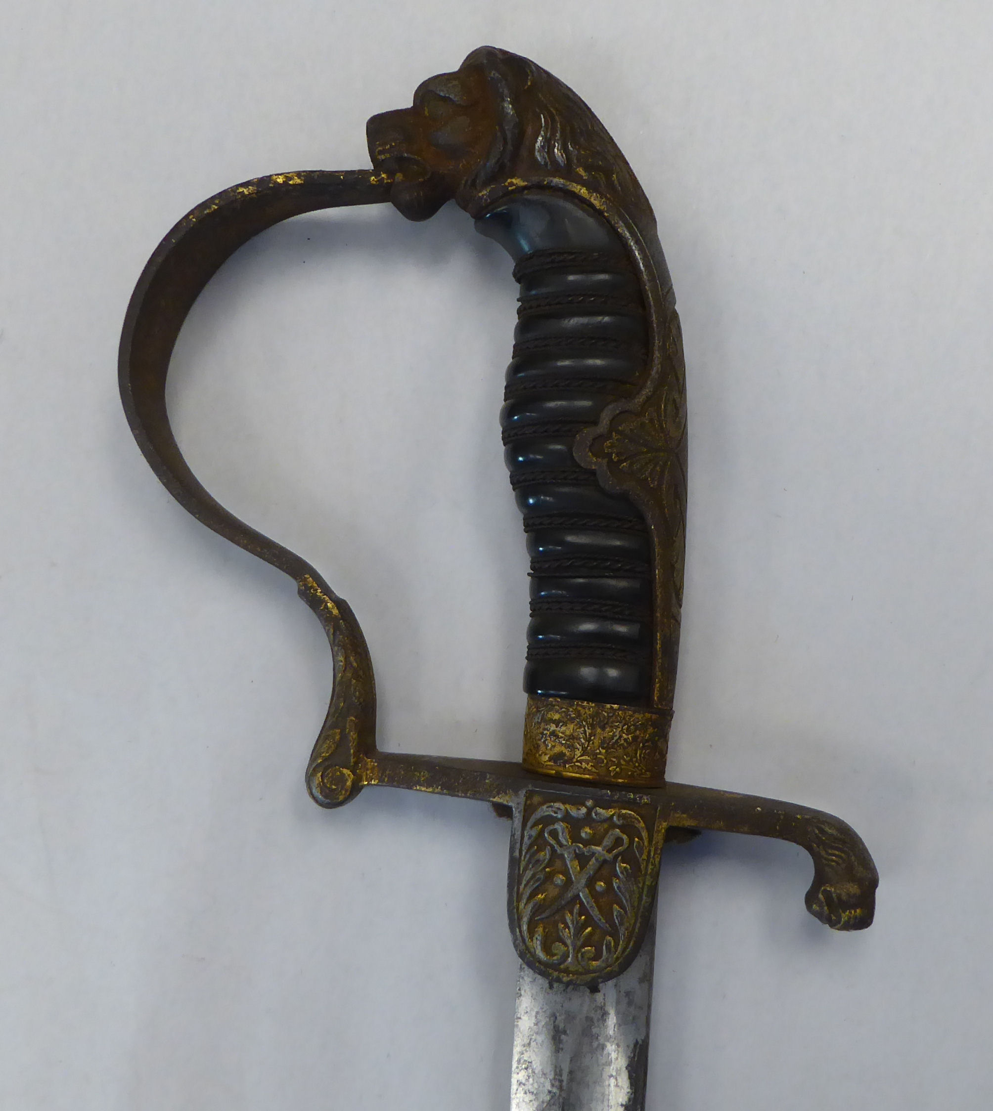 A German Weimar era cavalry dress sword with a gilded iron, lion's head pommel, guard, hilt and - Image 3 of 13