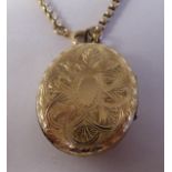 A Victorian yellow metal oval, engraved locket, on a belcher double opening link chain and ring-bolt