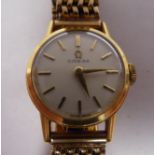 A ladies Omega 9ct gold cased bracelet wristwatch, faced by a baton dial