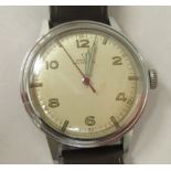 A 1942 Omega stainless steel cased wristwatch, the 16 jewel R17-85c movement with sweeping