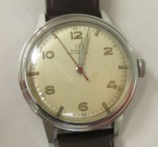 A 1942 Omega stainless steel cased wristwatch, the 16 jewel R17-85c movement with sweeping